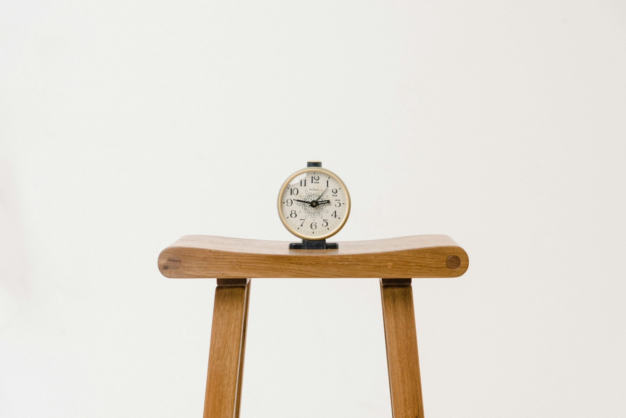 Clock sitting on a bench